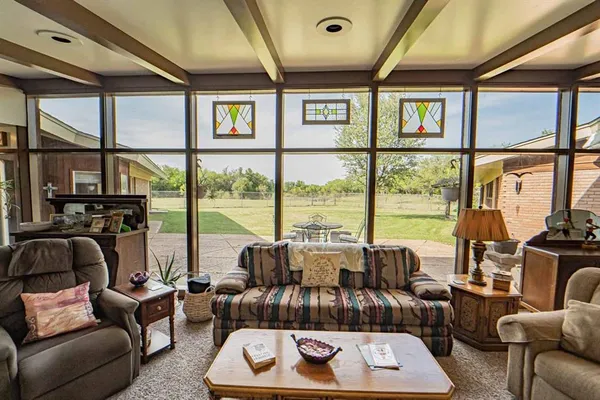 a dining room with furniture and window