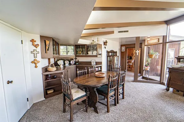 a living room with furniture and flat screen tv