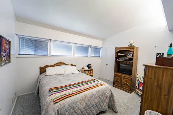 a room with furniture and gym equipment