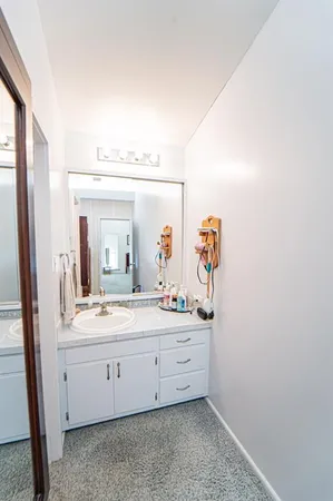 a view of walk in closet with clothes
