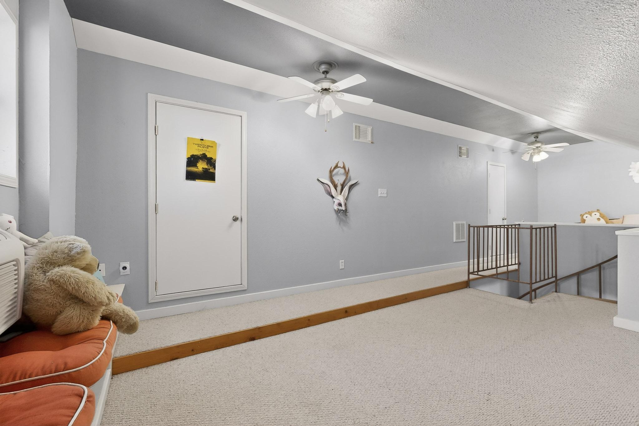 1619 Althaus Ranch Road Johnson City, TX 78636 - Photo 22 of 37 Private second Bedroom with sitting area, access to attic storage, reading nook