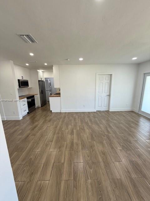 17860 Southwest 112th Court Miami, FL 33157 - Photo 12 of 17 a view of empty room with wooden floor