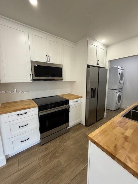 17860 Southwest 112th Court Miami, FL 33157 - Photo 13 of 17 a kitchen with granite countertop white cabinets and stainless steel appliances