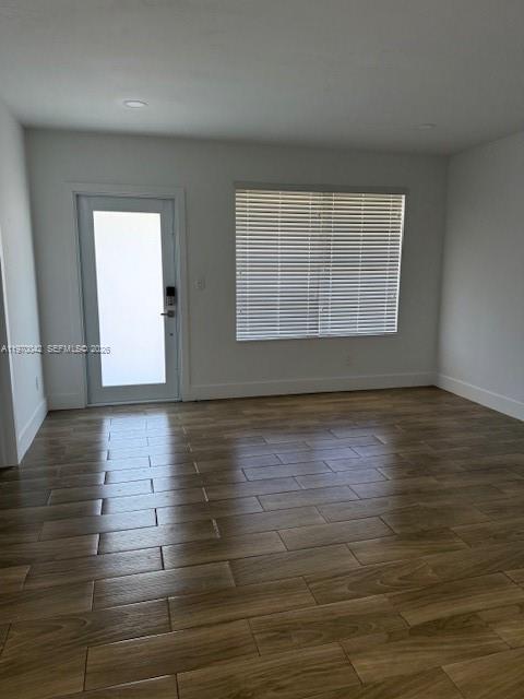 17860 Southwest 112th Court Miami, FL 33157 - Photo 3 of 17 a view of an empty room with wooden floor and a window