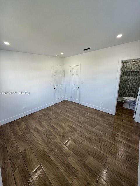 17860 Southwest 112th Court Miami, FL 33157 - Photo 4 of 17 an empty room with wooden floor and windows