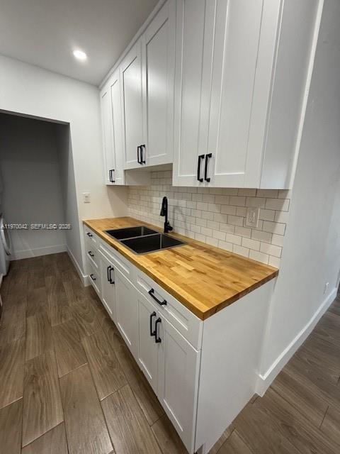 17860 Southwest 112th Court Miami, FL 33157 - Photo 7 of 17 a kitchen with granite countertop a stove a sink and white cabinets