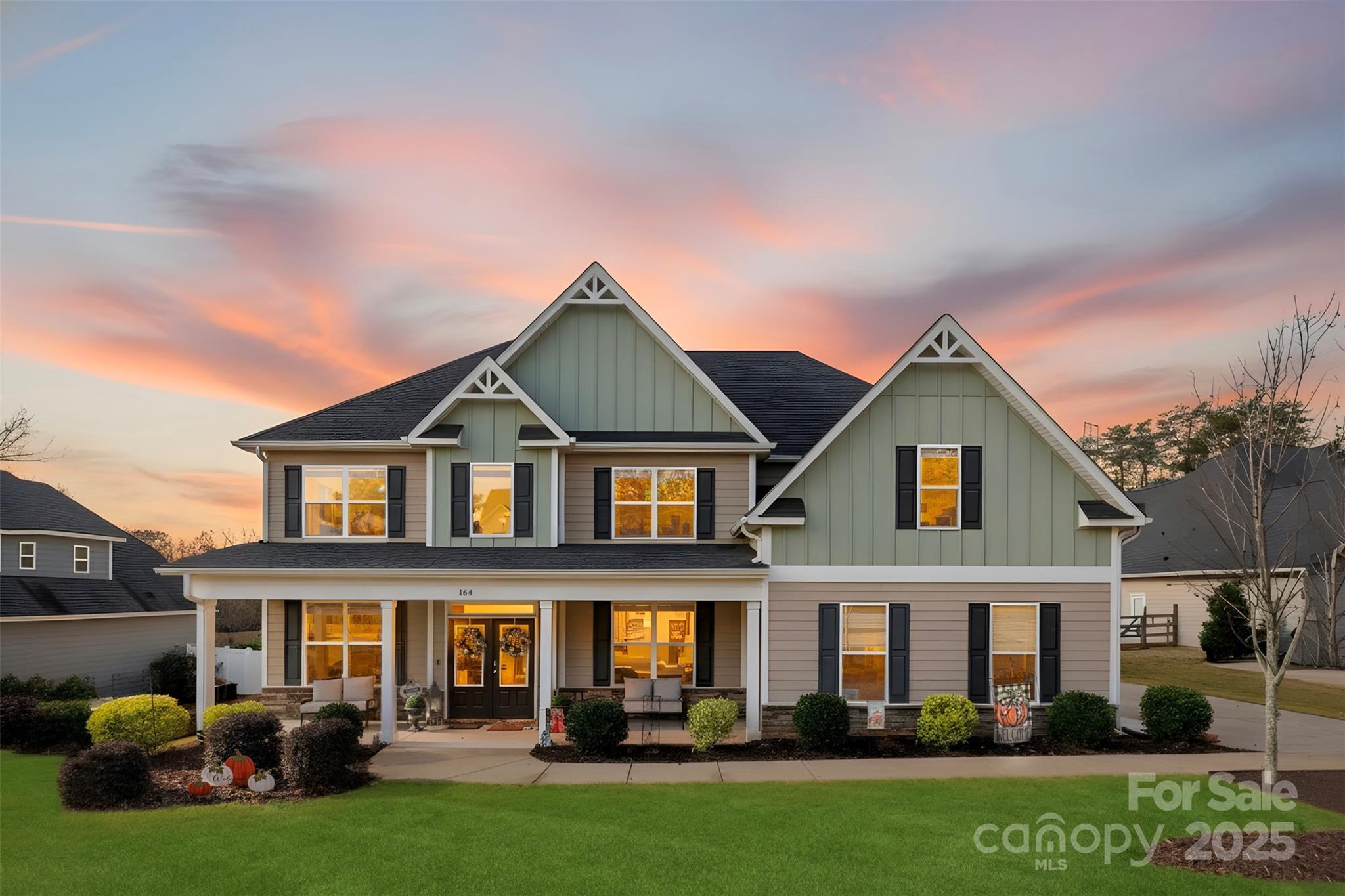 a front view of a house with garden