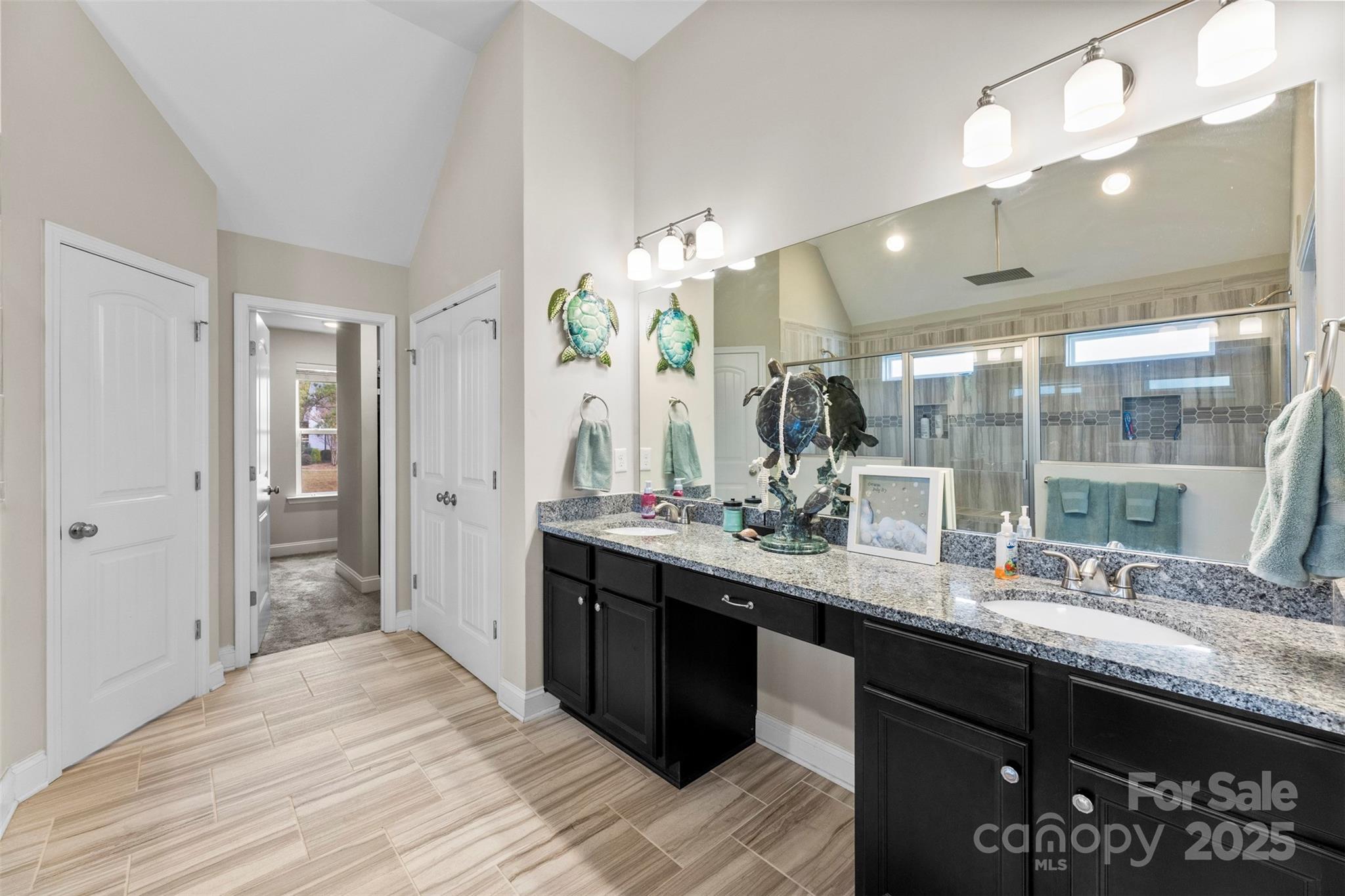 164 Reese Wilson Road Belmont, NC 28012 - Photo 14 of 27 a bathroom with a double vanity sink and a mirror