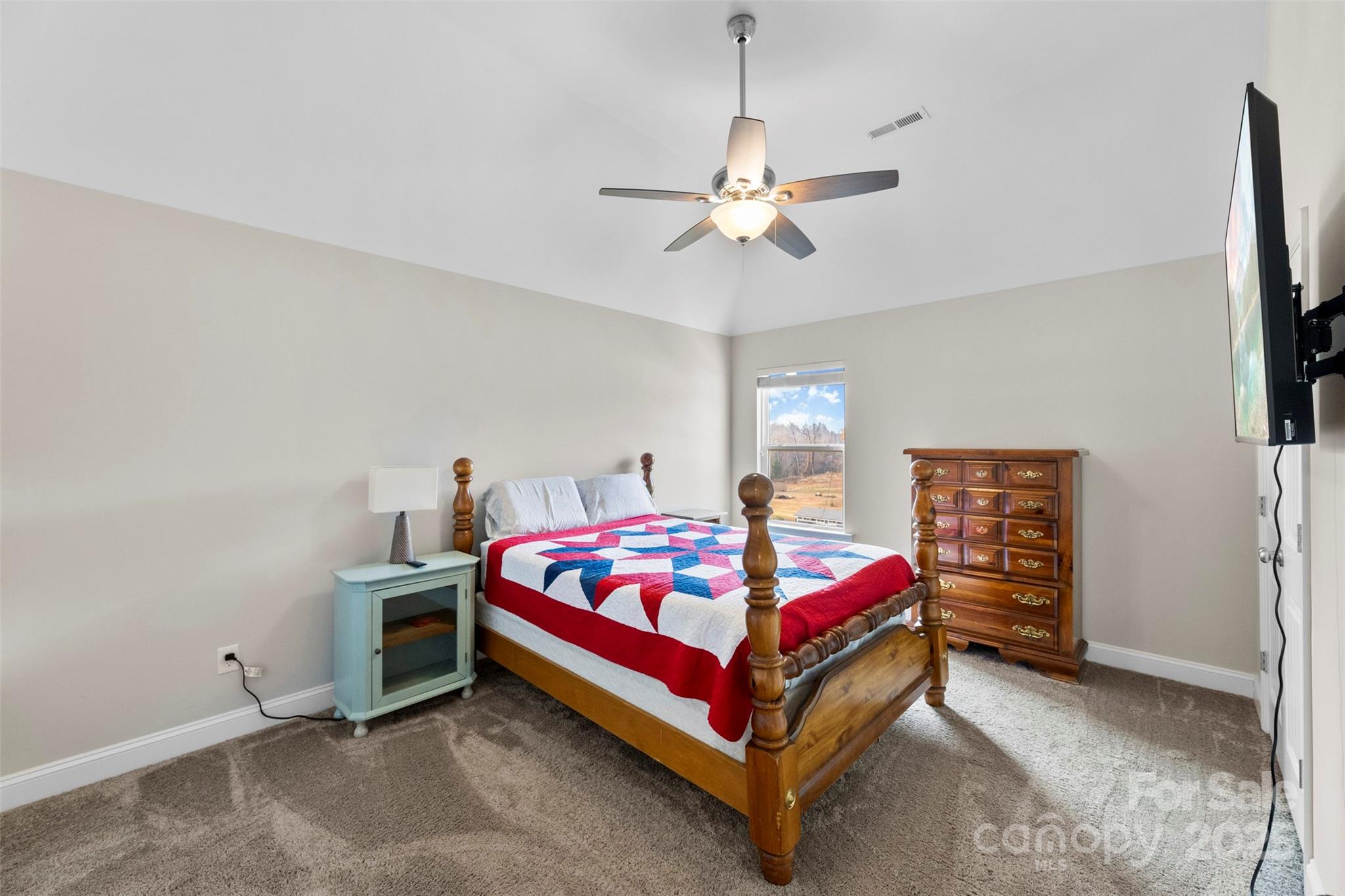 164 Reese Wilson Road Belmont, NC 28012 - Photo 17 of 27 a bedroom with a bed and a chandelier