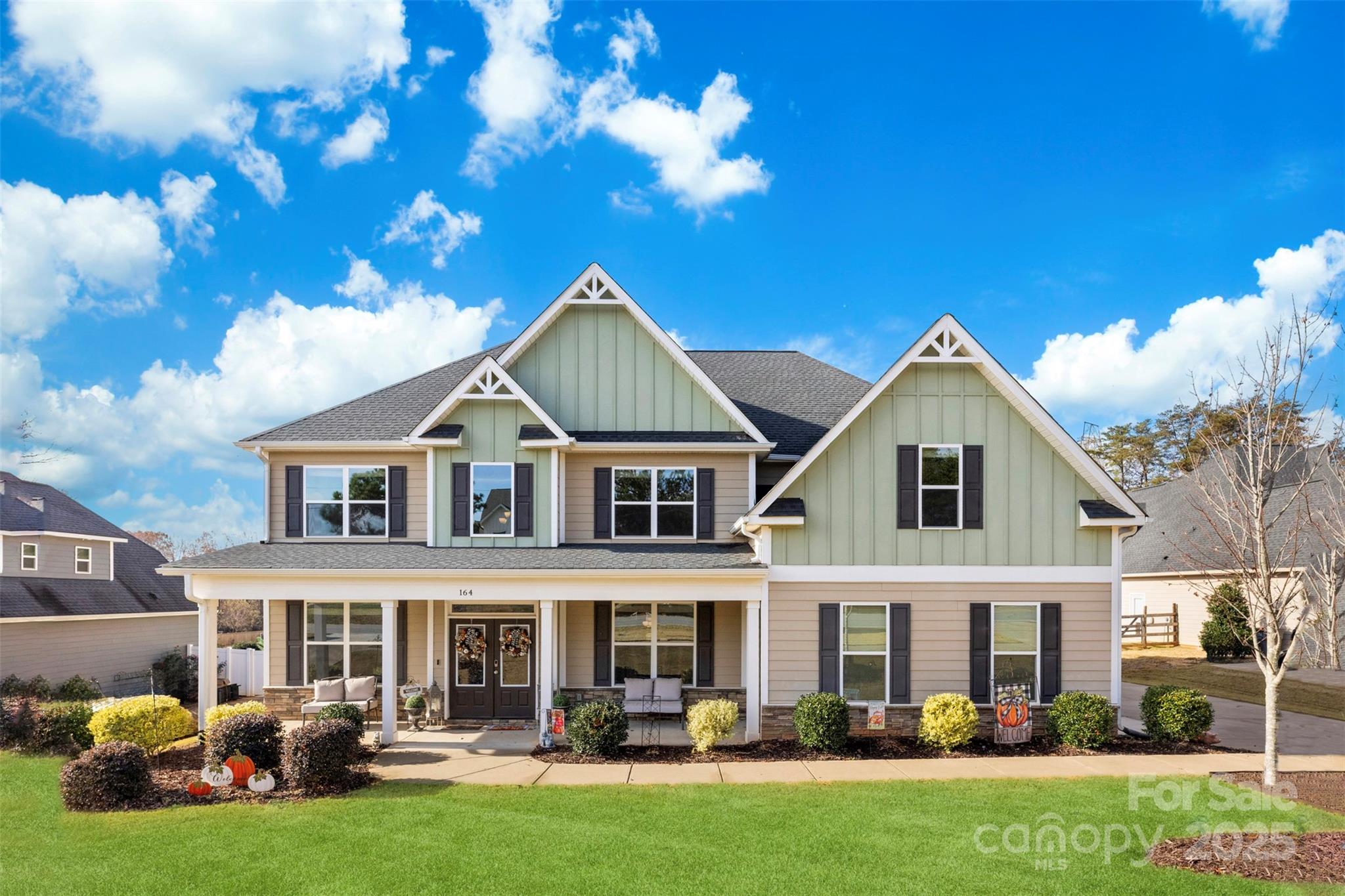 164 Reese Wilson Road Belmont, NC 28012 - Photo 2 of 27 a front view of a house with swimming pool and chairs