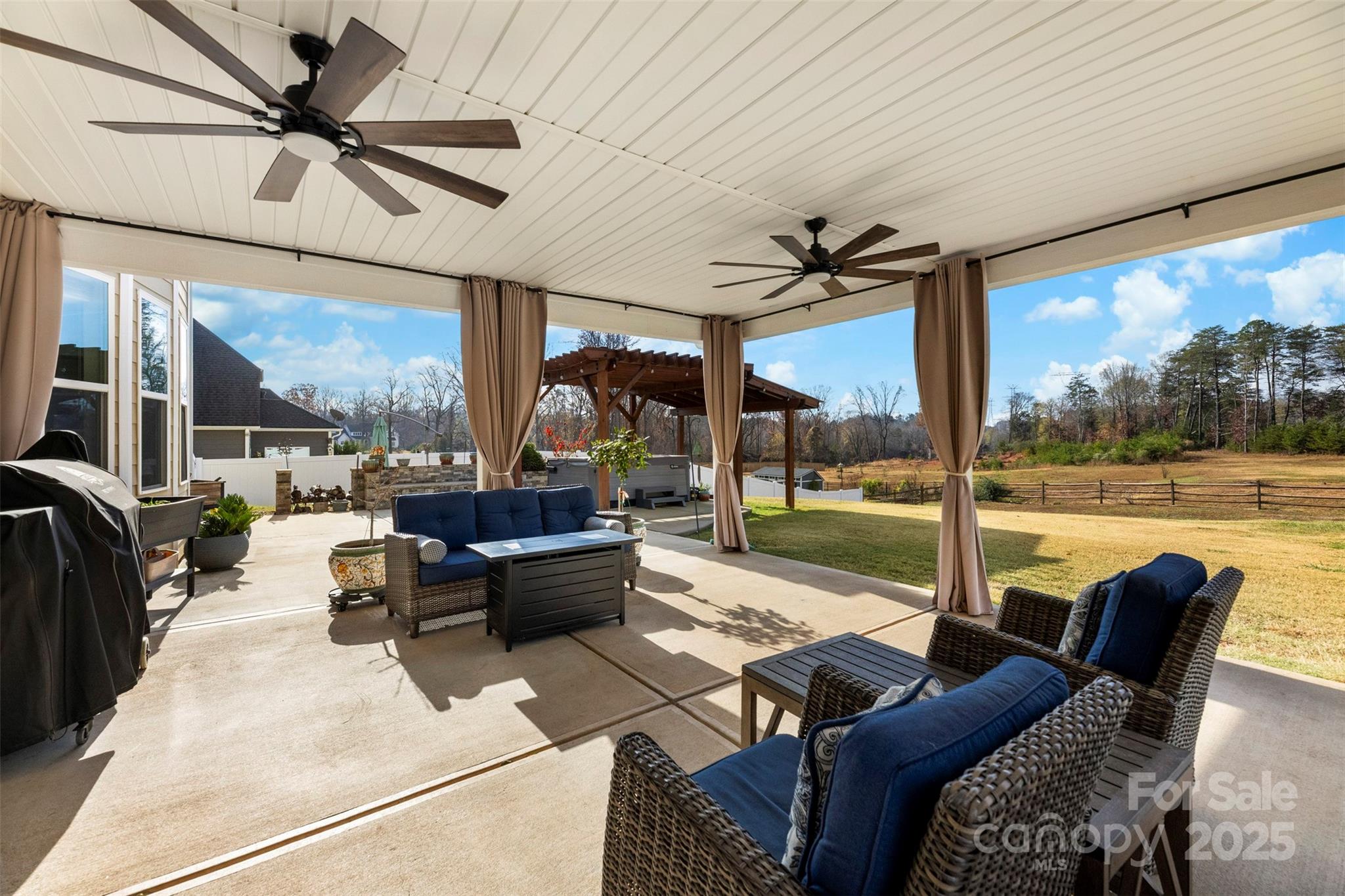 164 Reese Wilson Road Belmont, NC 28012 - Photo 24 of 27 a living room with patio furniture and a floor to ceiling window