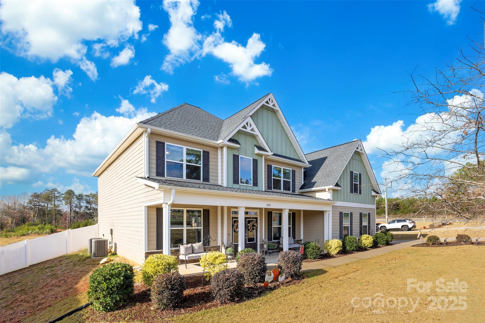 164 Reese Wilson Road Belmont, NC 28012 - Photo 3 of 27 a front view of a house with a yard