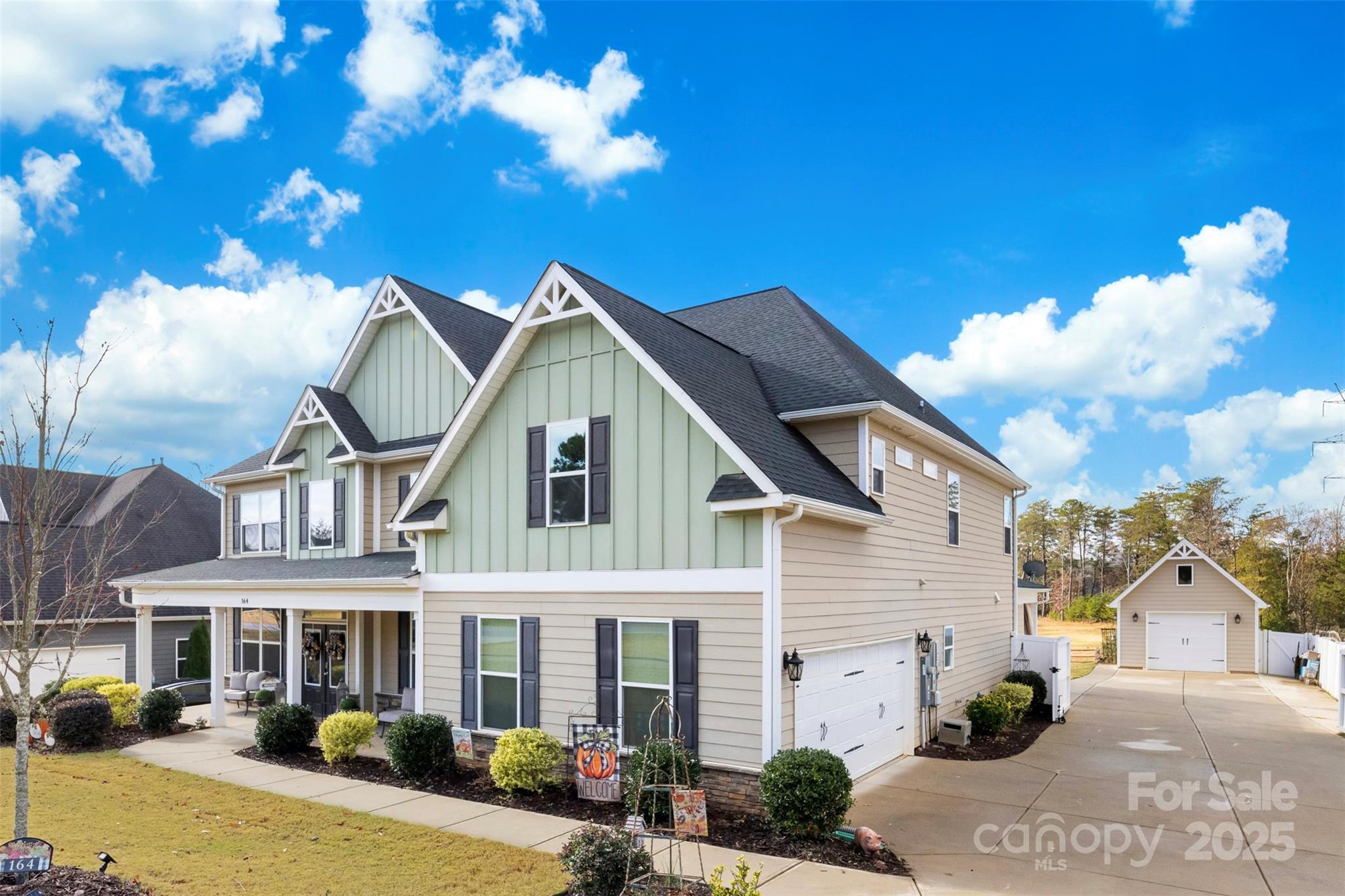 164 Reese Wilson Road Belmont, NC 28012 - Photo 4 of 27 a view of a white house with a table and chairs