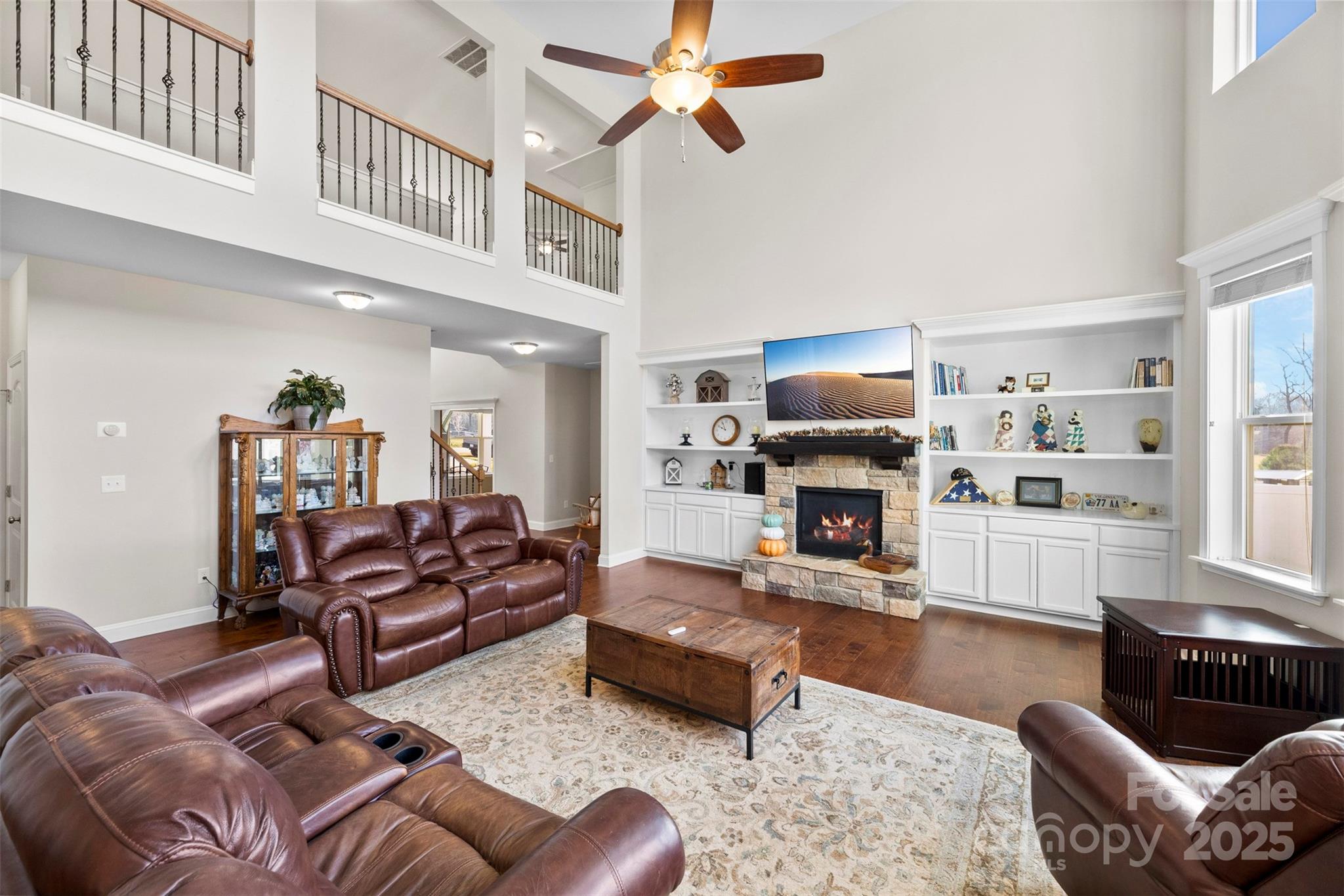 164 Reese Wilson Road Belmont, NC 28012 - Photo 6 of 27 a living room with furniture a fireplace and a large window
