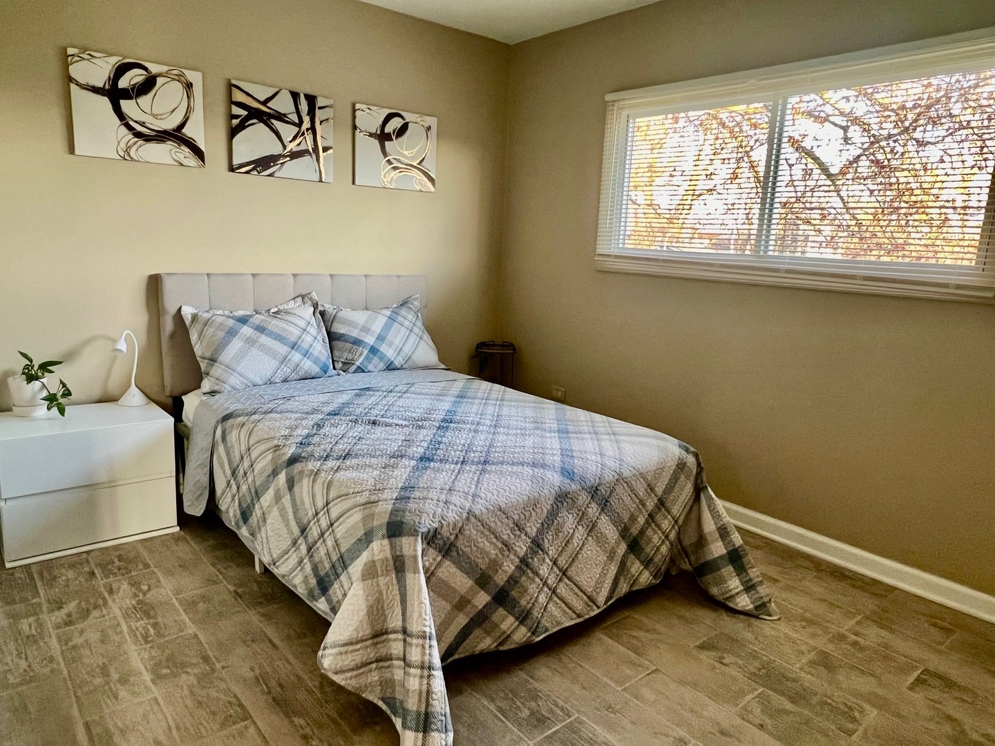 4764 South Shields Avenue Chicago, IL 60609 - Photo 9 of 10 a bed sitting in a bedroom next to a window