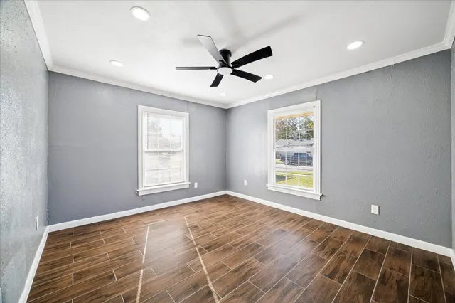 a view of an empty room with a window