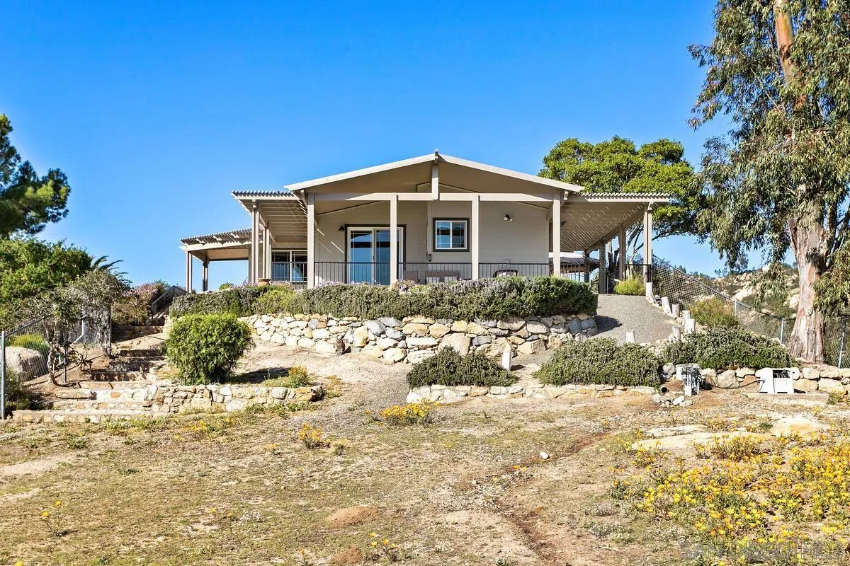 6167 Rainbow Heights Road Fallbrook, CA 92028 - Photo 8 of 44 a front view of a house with a yard