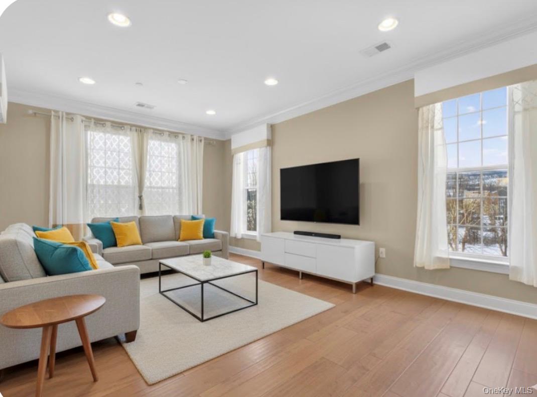 734 Regency Drive Fishkill, NY 12524 - Photo 21 of 50 a living room with furniture and a flat screen tv