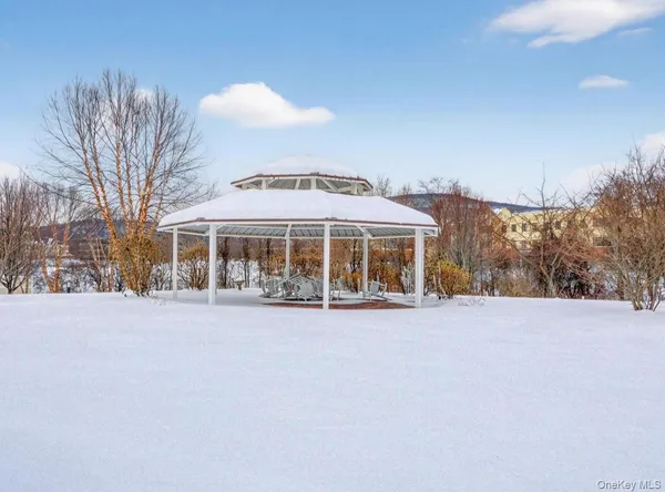view of small space with wooden floor and closet