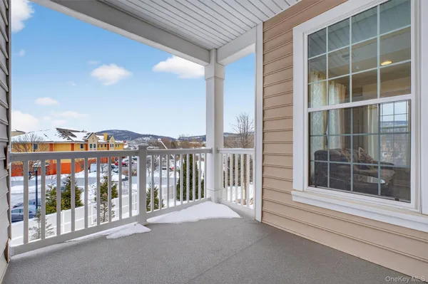 a view of a patio with a table and chairs