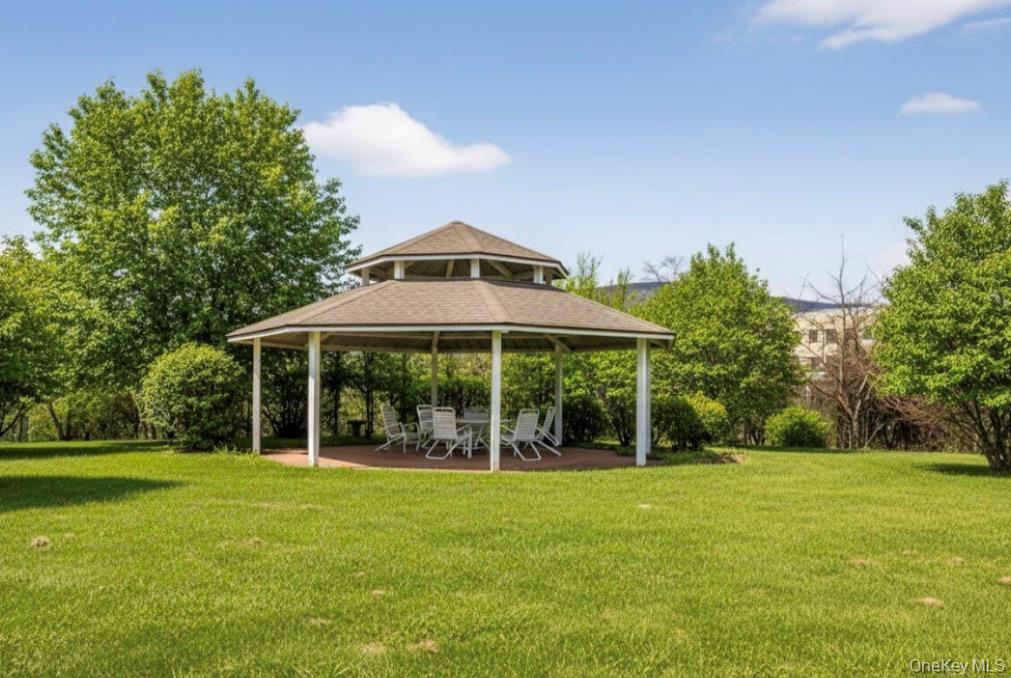 734 Regency Drive Fishkill, NY 12524 - Photo 4 of 50 a front view of house with yard and green space