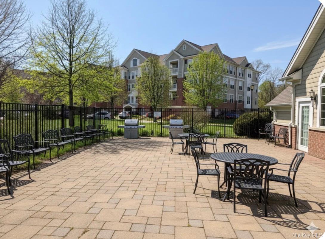 734 Regency Drive Fishkill, NY 12524 - Photo 46 of 50 a view of a patio with a table and chairs