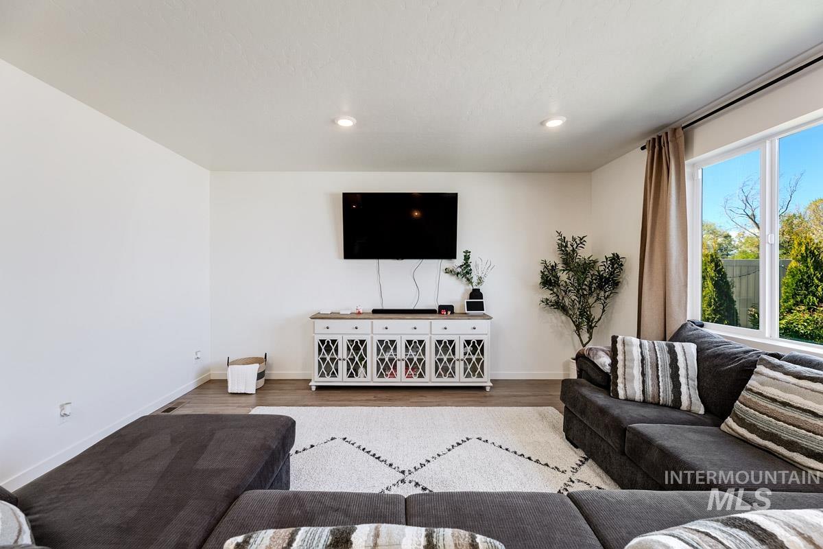 4469 South Colditz Way Meridian, ID 83642 - Photo 12 of 30 Spacious interior with neutral walls, recessed lighting, and wood-finish flooring