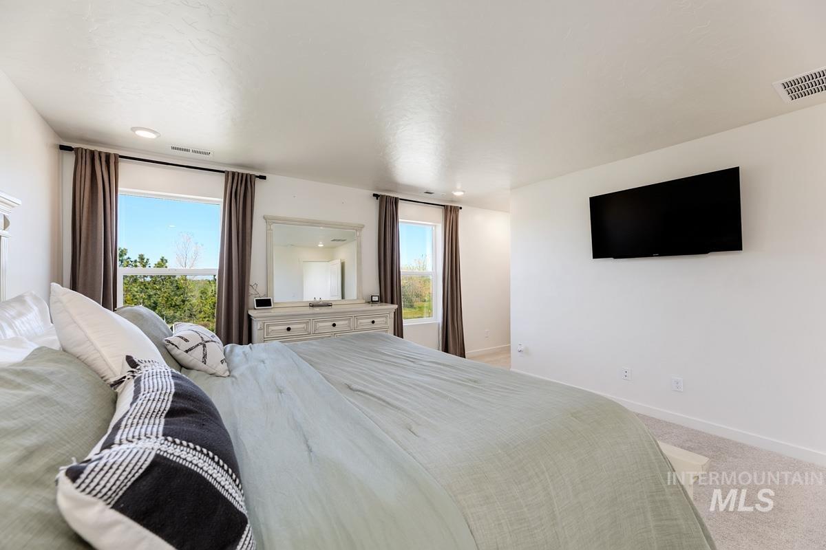 4469 South Colditz Way Meridian, ID 83642 - Photo 17 of 30 Spacious room featuring multiple windows with natural light, recessed lighting, and light-toned carpeting