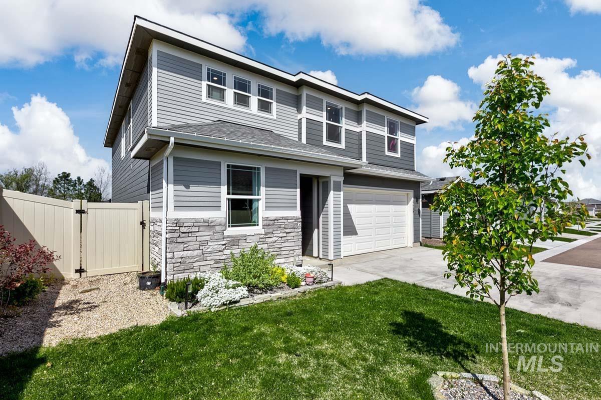 4469 South Colditz Way Meridian, ID 83642 - Photo 2 of 30 Modern two-story residence featuring gray siding and stone veneer accents