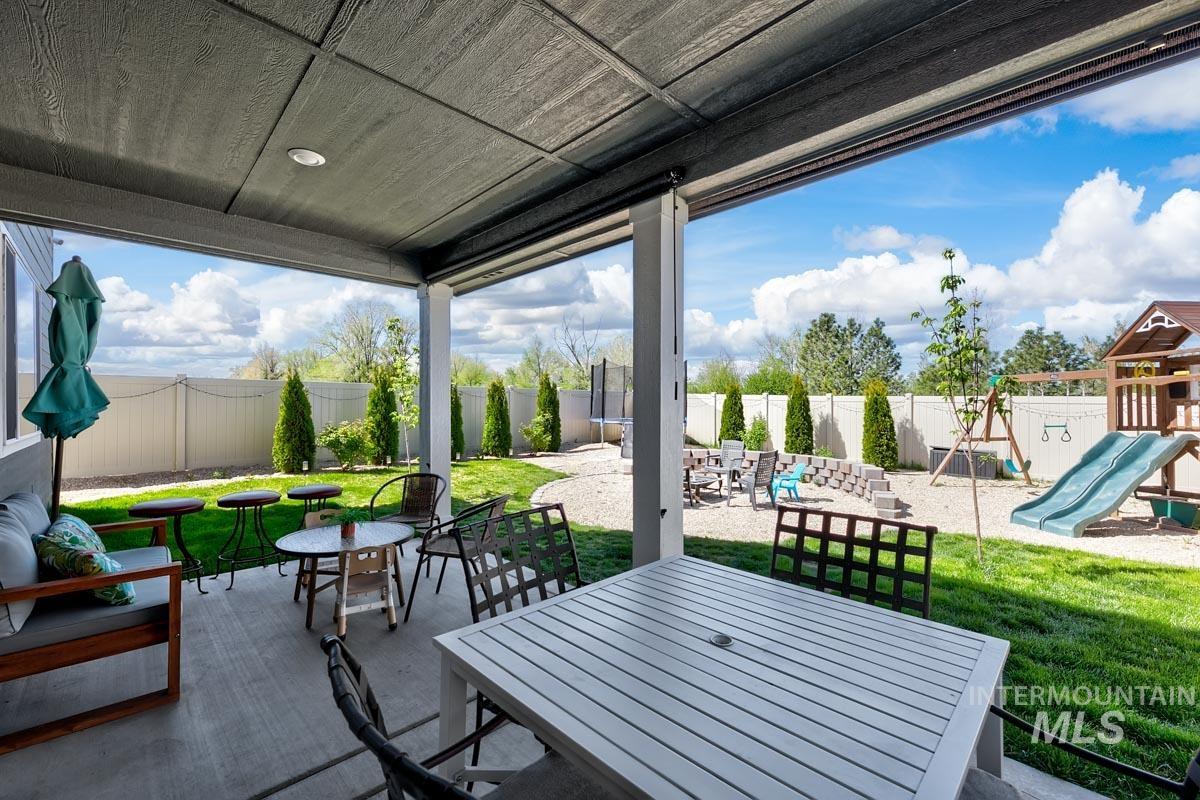 4469 South Colditz Way Meridian, ID 83642 - Photo 26 of 30 Covered patio with recessed lighting overlooking a fenced backyard