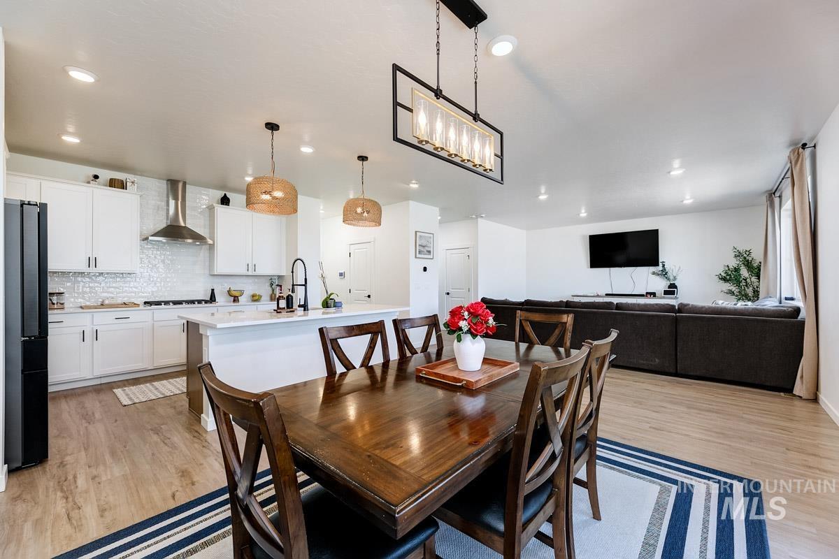 4469 South Colditz Way Meridian, ID 83642 - Photo 10 of 30 Open-concept living area featuring wood-finish flooring