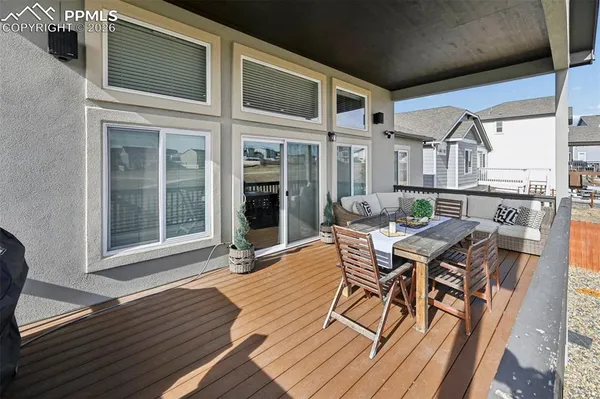 a patio with table and chairs