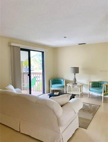 a bedroom with a large bed and a large window