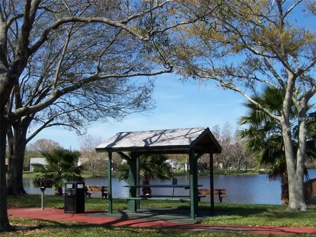 a view of a swimming pool with a lounge chair