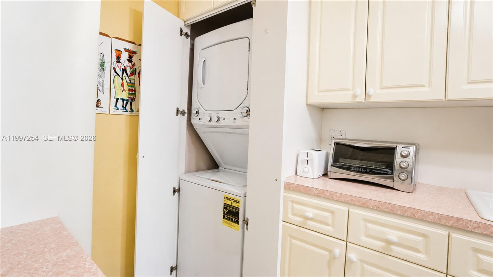 100 Lincoln Road, Unit 422 Miami Beach, FL 33139 - Photo 5 of 23 a utility room with dryer and washer