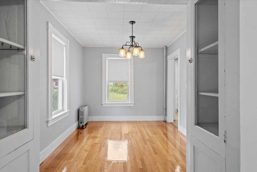 131 South Main Street Clinton, MA 01510 - Photo 11 of 36 a very nice looking room with a windows and a chandelier