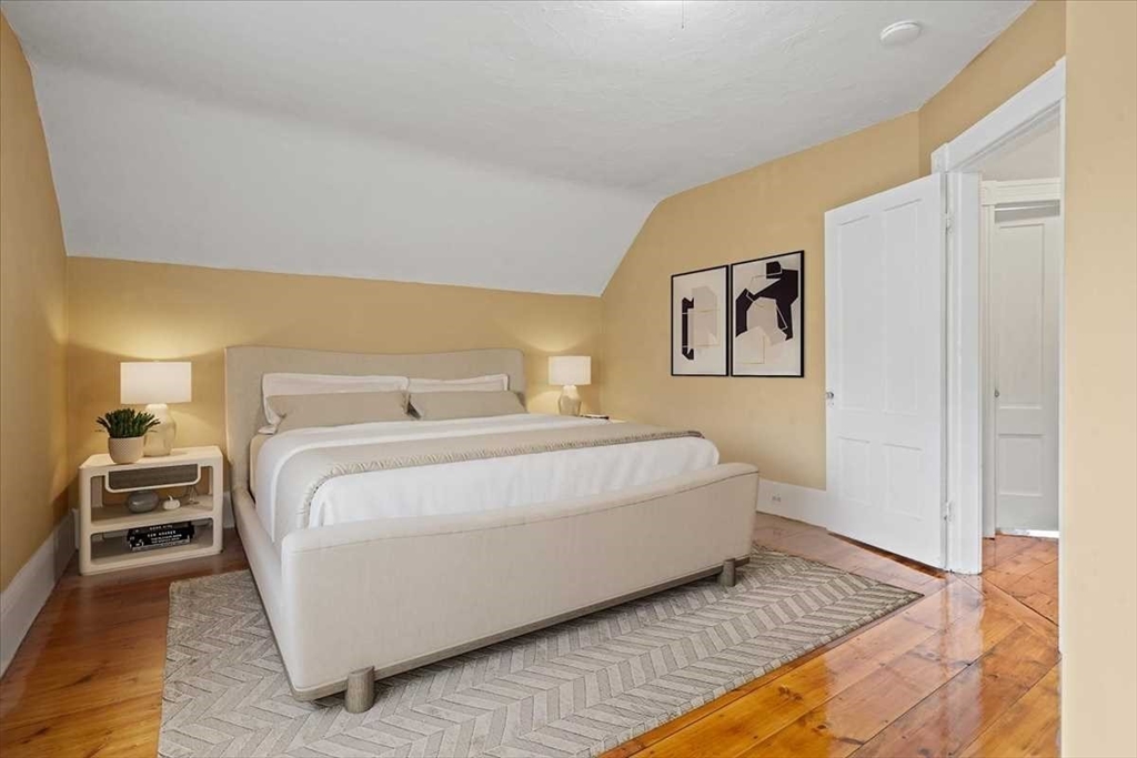 131 South Main Street Clinton, MA 01510 - Photo 22 of 36 a bedroom with a bed and a lamp