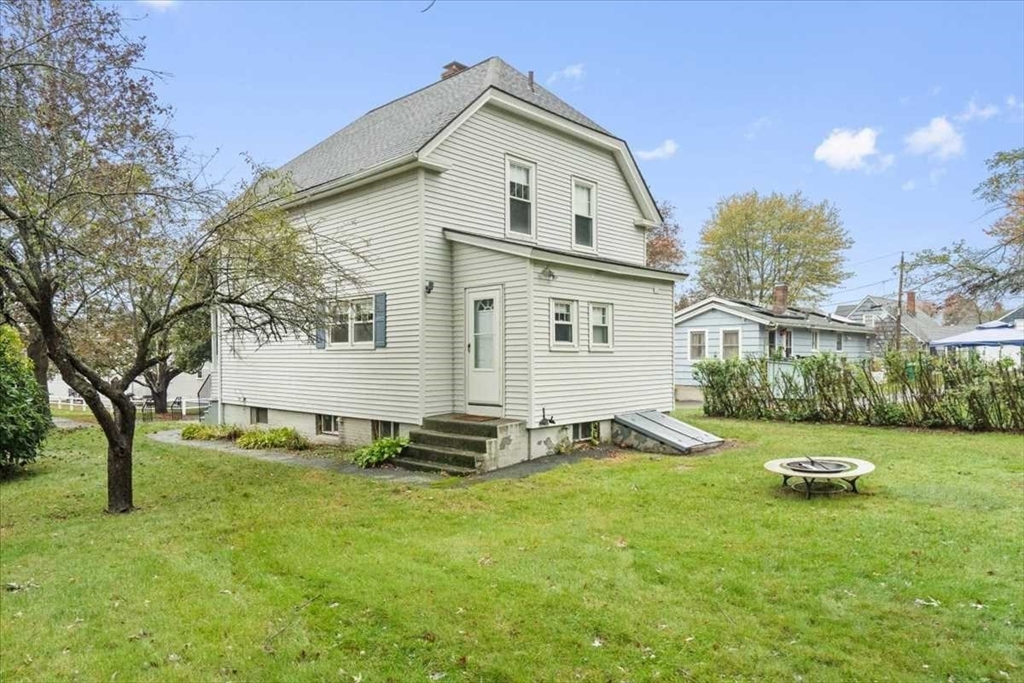 131 South Main Street Clinton, MA 01510 - Photo 32 of 36 a view of a house with backyard and trees