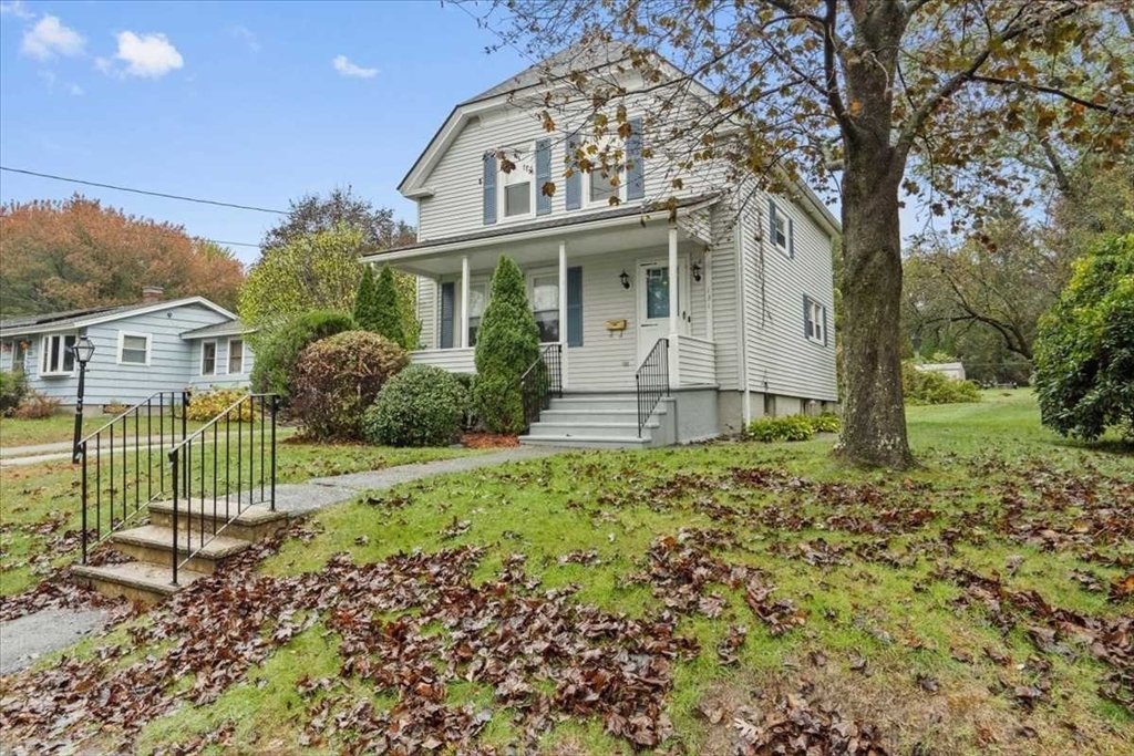 131 South Main Street Clinton, MA 01510 - Photo 4 of 36 a view of a house with a small yard and plants