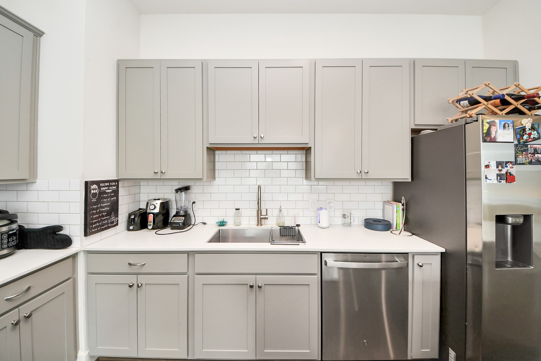 3622 Griggs Road Houston, TX 77021 - Photo 21 of 30 a kitchen with stainless steel appliances white cabinets sink and a refrigerator