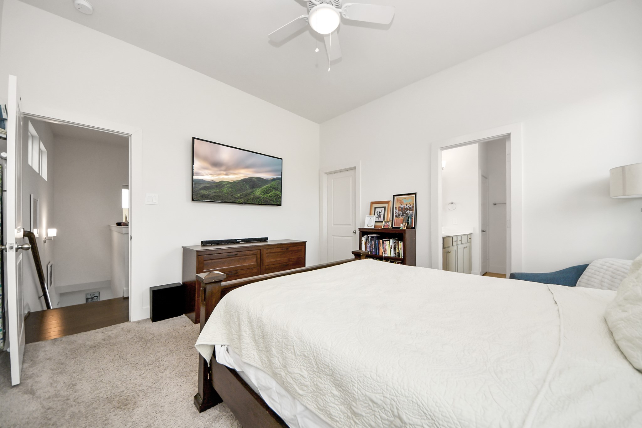 3622 Griggs Road Houston, TX 77021 - Photo 24 of 30 a bedroom with a bed and a chandelier