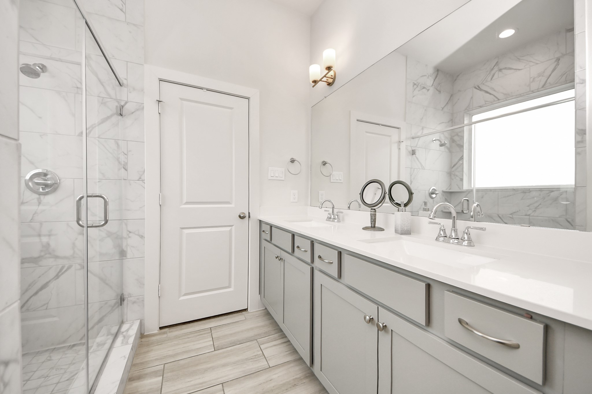 3622 Griggs Road Houston, TX 77021 - Photo 27 of 30 a spacious bathroom with a double vanity sink a mirror and shower