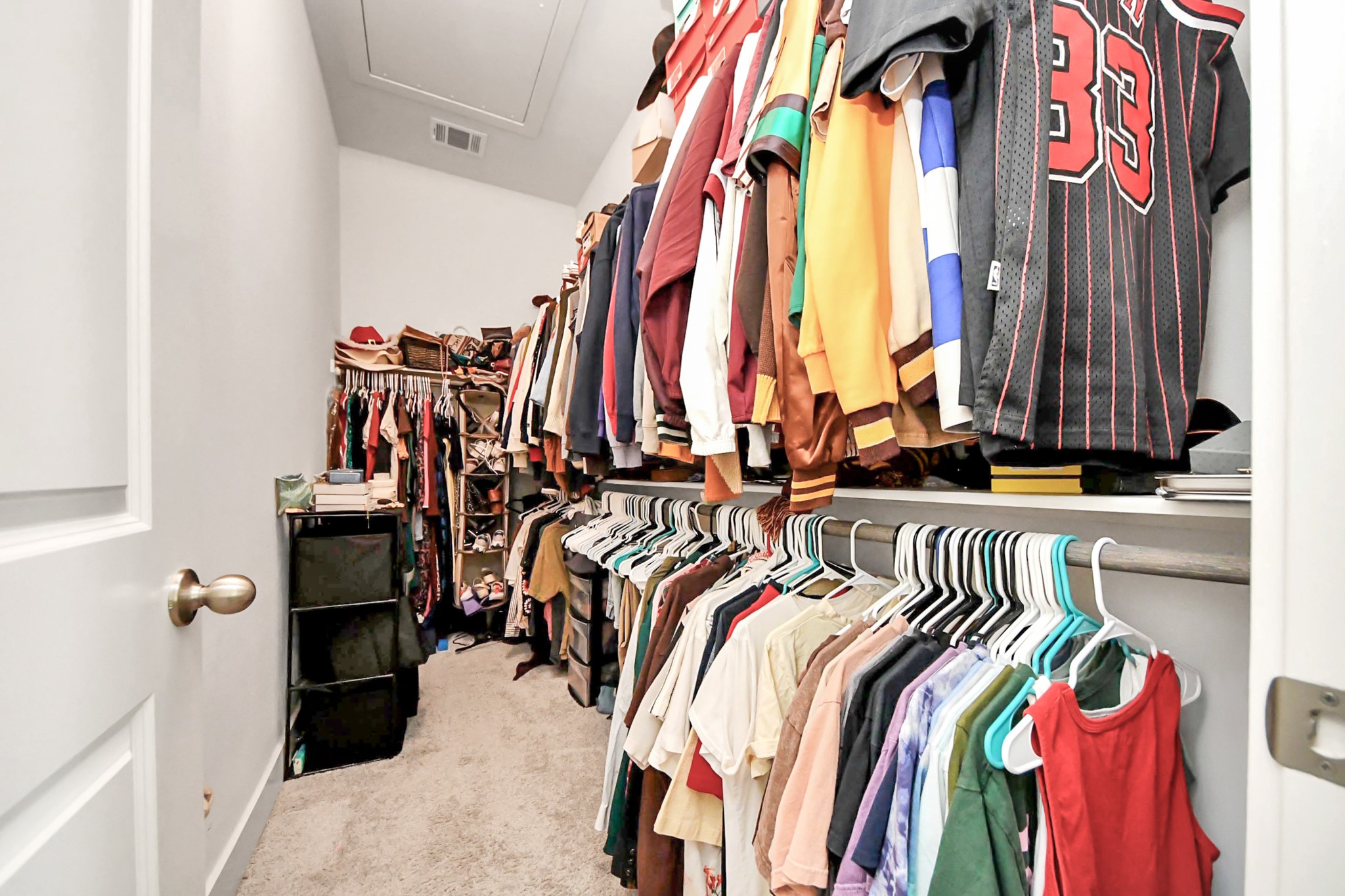 3622 Griggs Road Houston, TX 77021 - Photo 28 of 30 a view of walk in closet with clothes and shoes