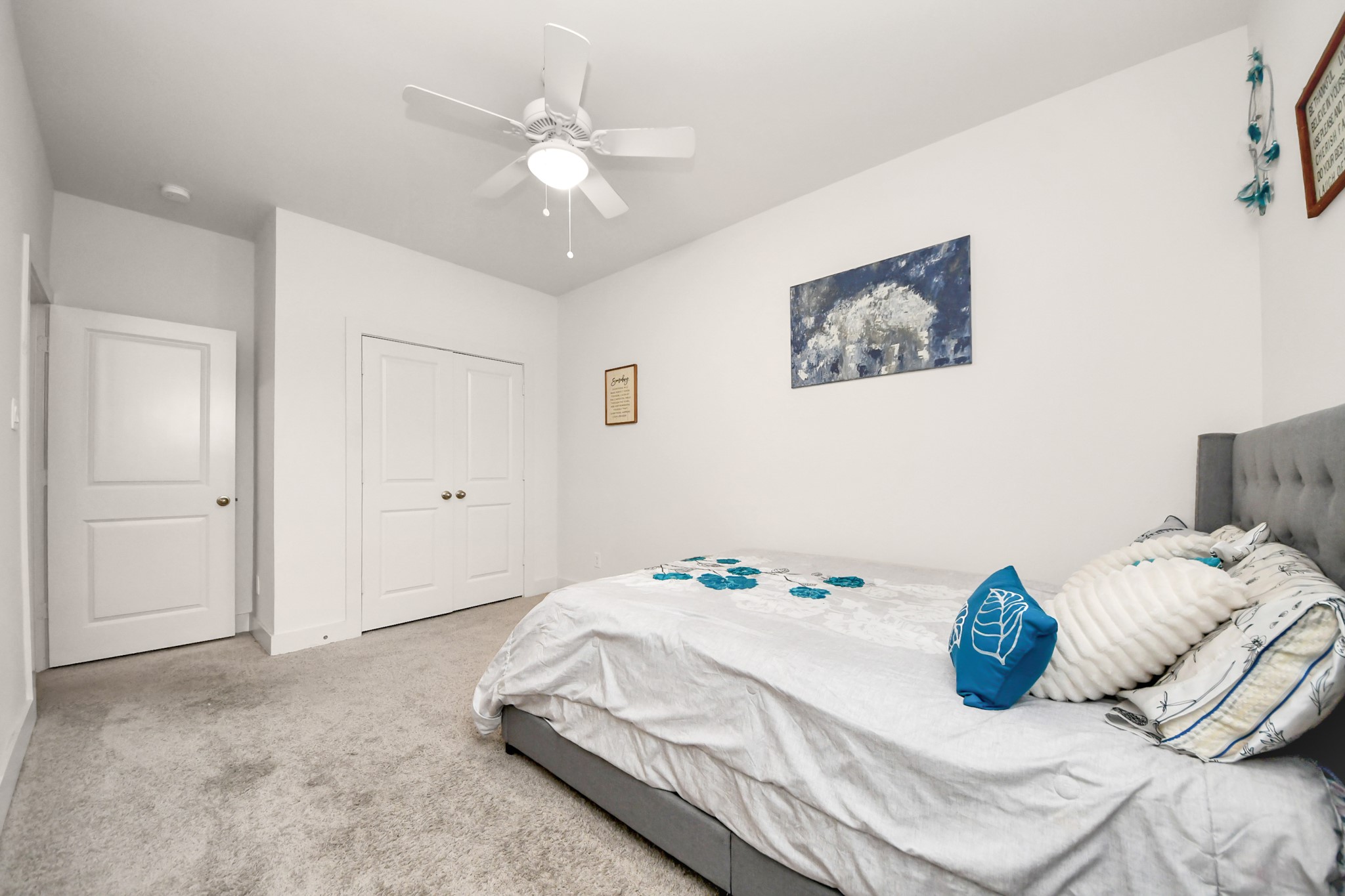 3622 Griggs Road Houston, TX 77021 - Photo 7 of 30 a bedroom with a bed and a chandelier