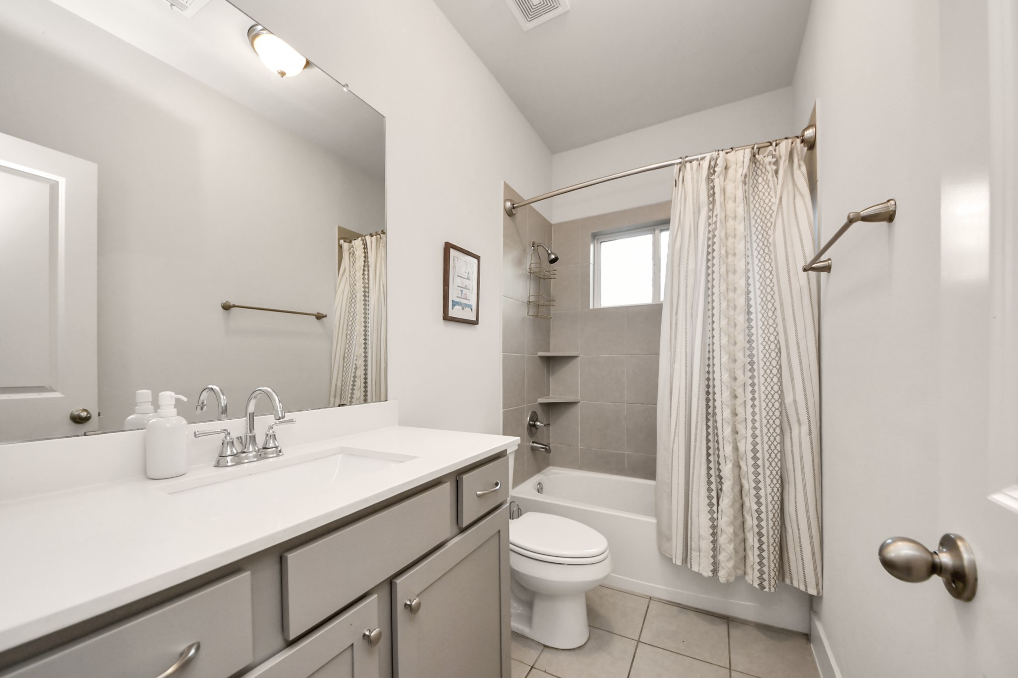 3622 Griggs Road Houston, TX 77021 - Photo 9 of 30 a bathroom with a sink a toilet a mirror and shower