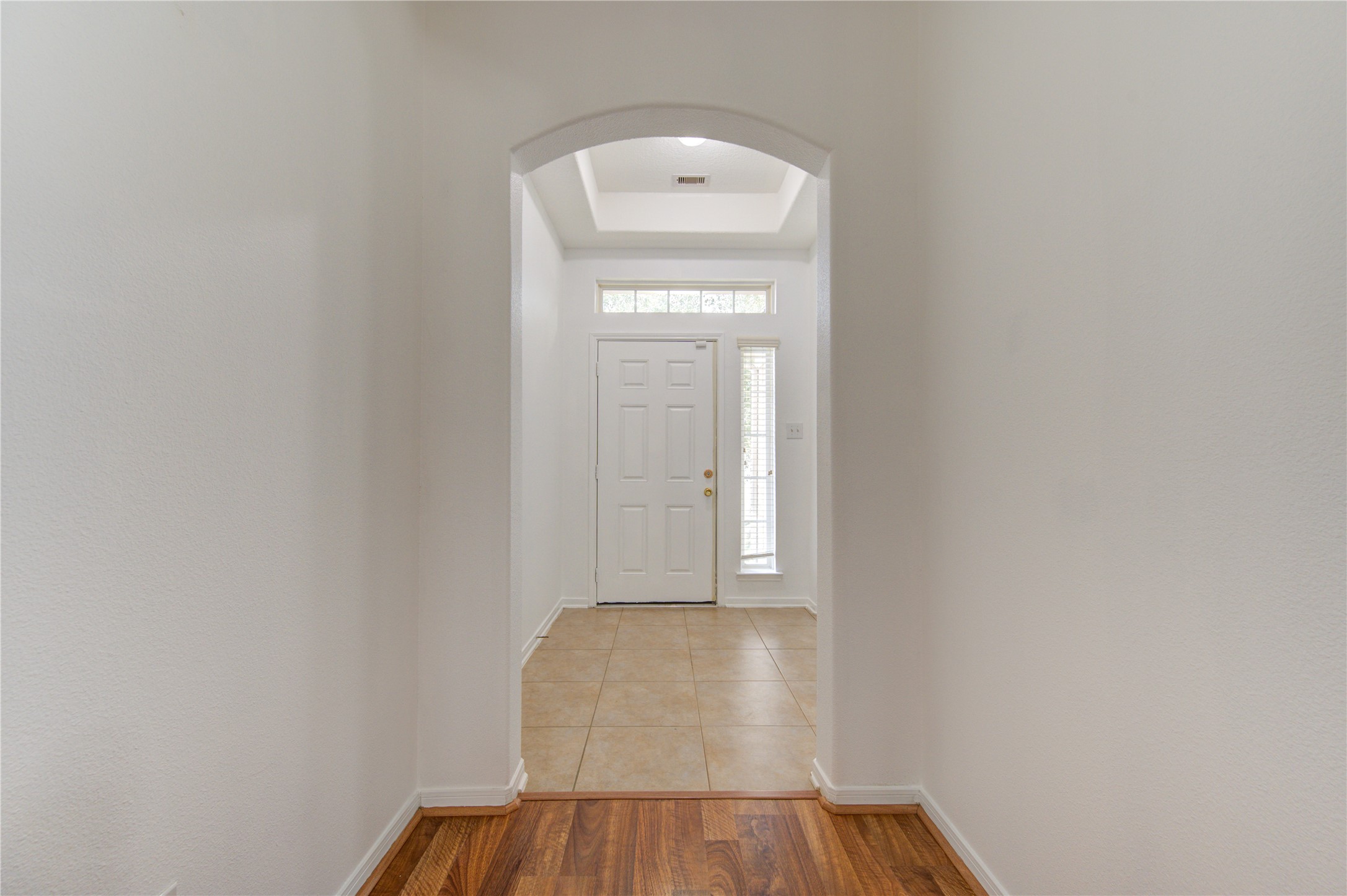 14315 Acorn Ridge Way Cypress, TX 77429 - Photo 2 of 22 a view of a hallway with wooden floor and a window