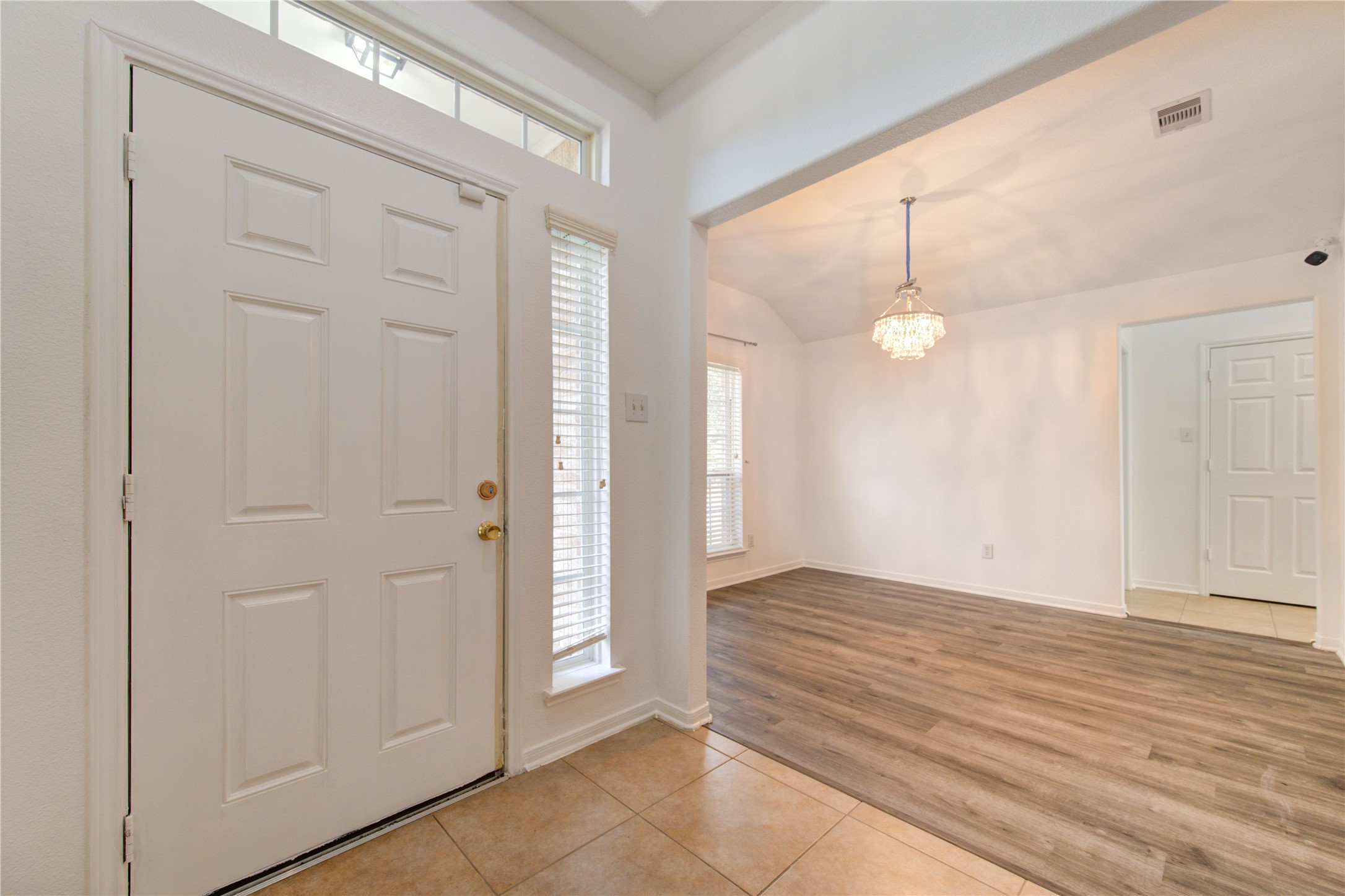14315 Acorn Ridge Way Cypress, TX 77429 - Photo 3 of 22 an empty room with wooden floor and windows