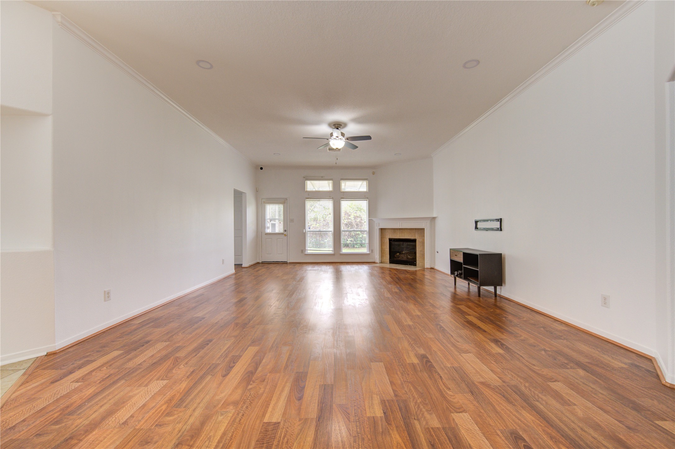 14315 Acorn Ridge Way Cypress, TX 77429 - Photo 7 of 22 wooden floor in an empty room with a window