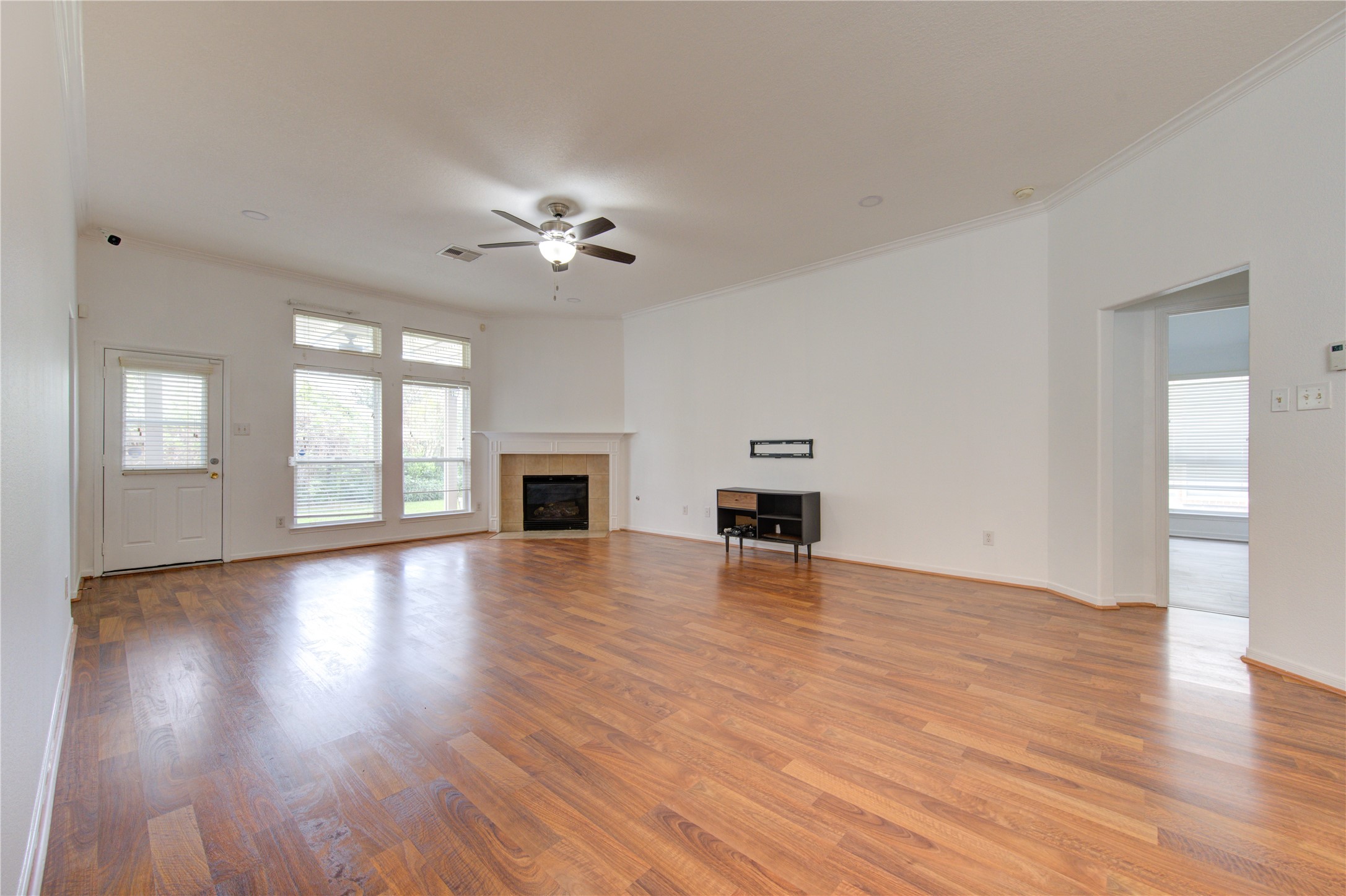 14315 Acorn Ridge Way Cypress, TX 77429 - Photo 8 of 22 a view of an empty room with window and wooden floor