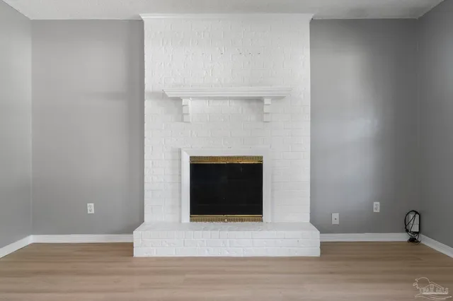 a kitchen with granite countertop a refrigerator and a sink